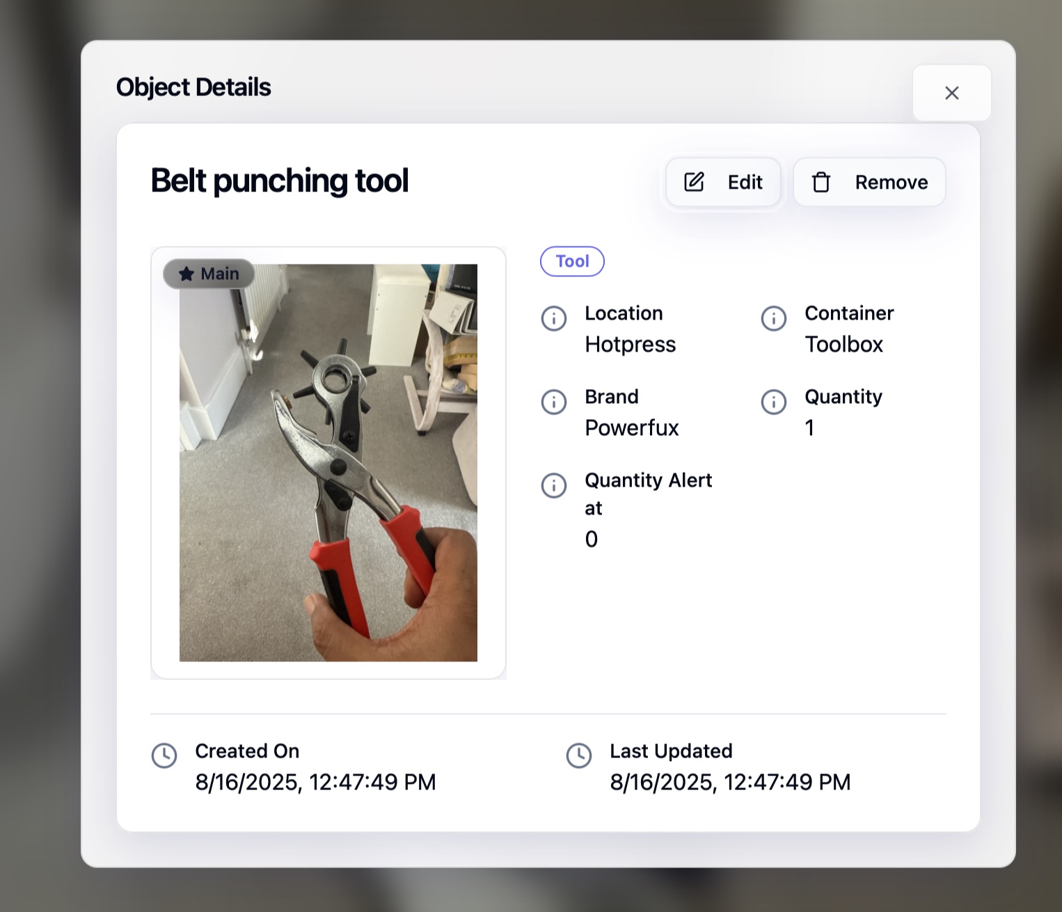 JiiaCat object detail for a belt punching tool showing photo, location Hotpress, container Toolbox, brand, and quantity